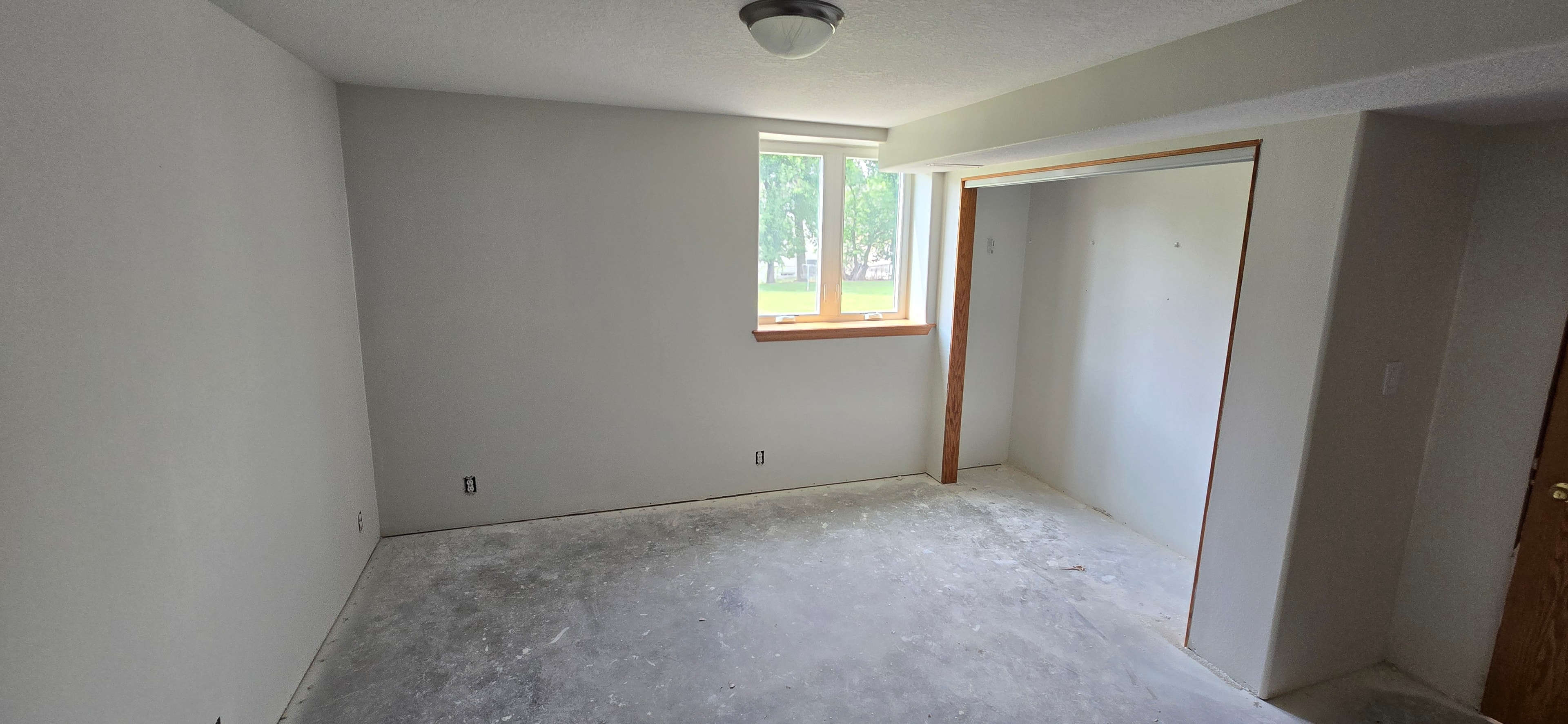 Completed basement bedroom — H&H Construction Services