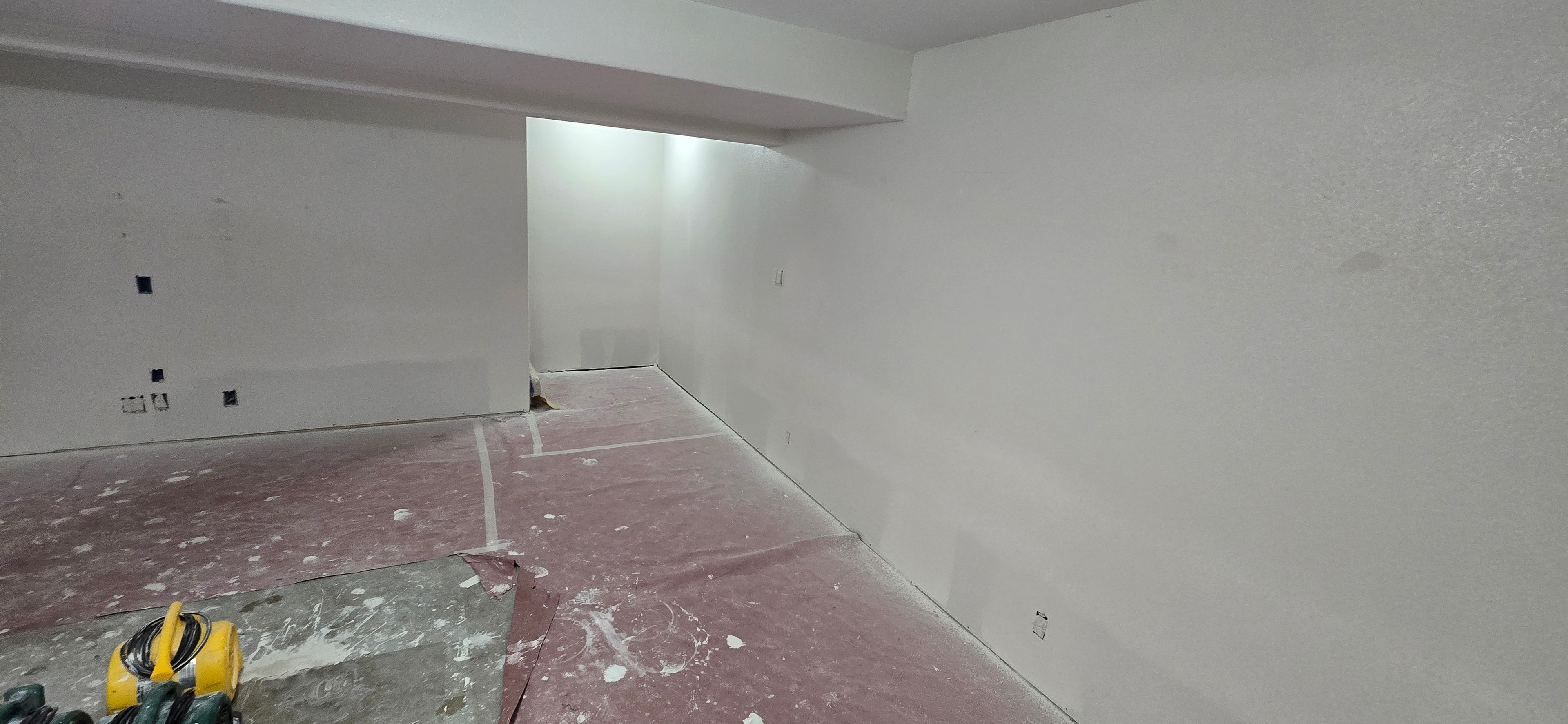 Basement main room before drywall repair — H&H Construction Services
