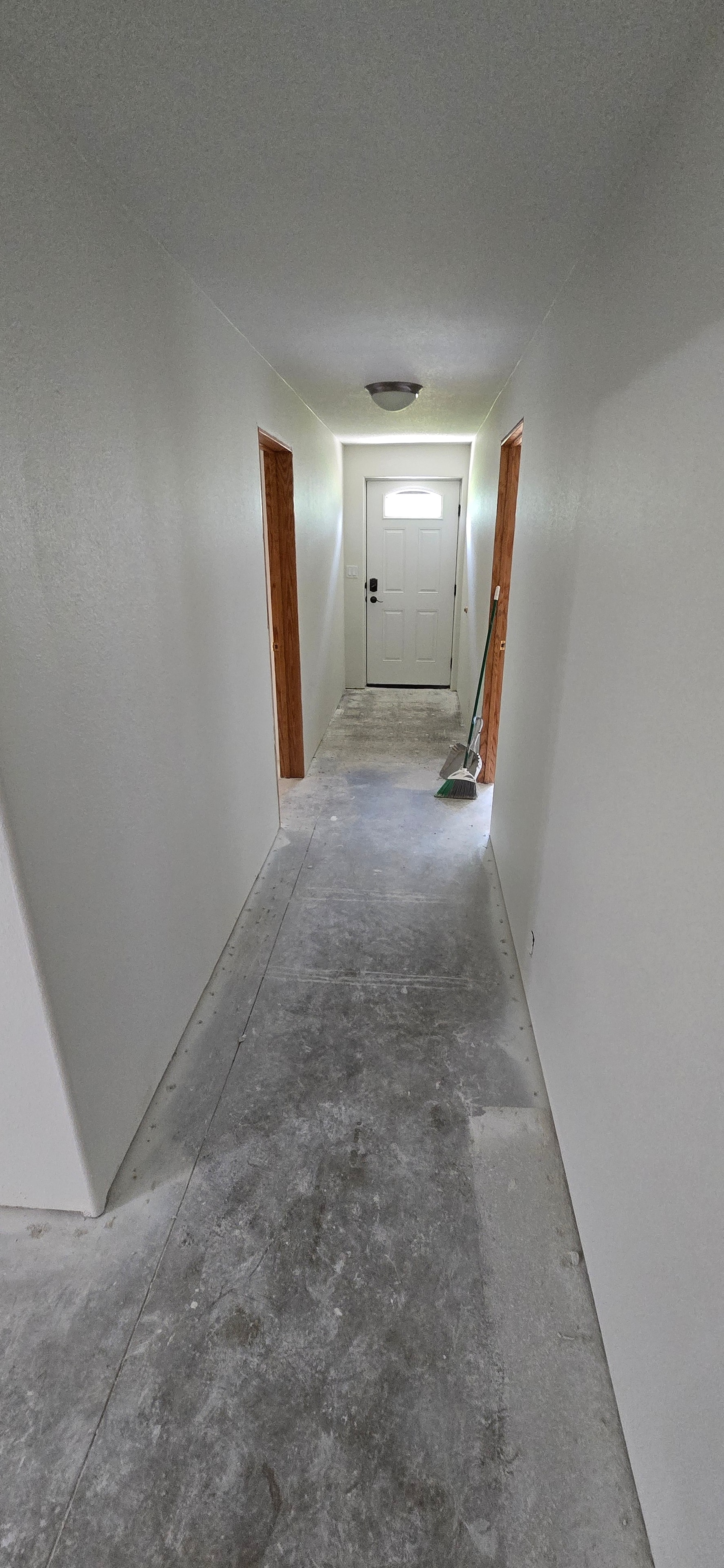 Basement main room with fresh drywall — H&H Construction Services